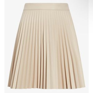 Cream pleated faux leather tennis skirt from Express!